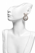 Classic pearl accent centerpiece surrounded by sparkling stone detailing Earrings