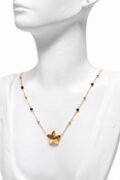 Fine lightweight graceful floral -inspired pendant complemented by subtle black  and golden coloured bead accents necklace.