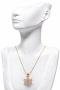 Floral inspire crystal pendant with fine chain.