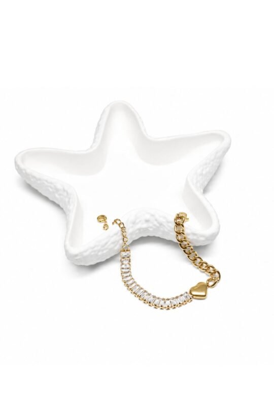 Baguette-cut clear crystals and delicate gold-tone chain with charming Heart Bracelet.